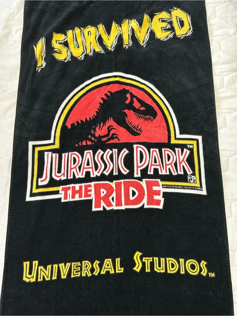 vintage 1990s Jurassic Park The Ride beach towel featuring the iconic movie logo